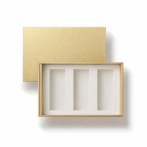 Gold jewelry box with a white interior on a white background